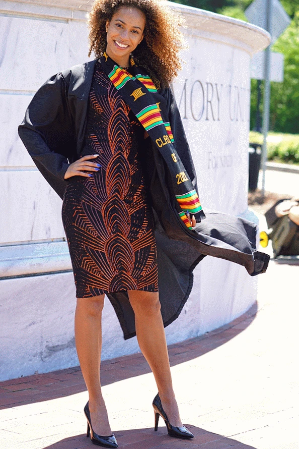 Claire in her graduation gown and Class of 2021 stole.