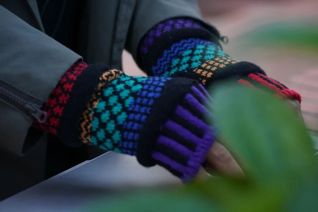 A closer look at the color and knit texture of the fingerless gloves.